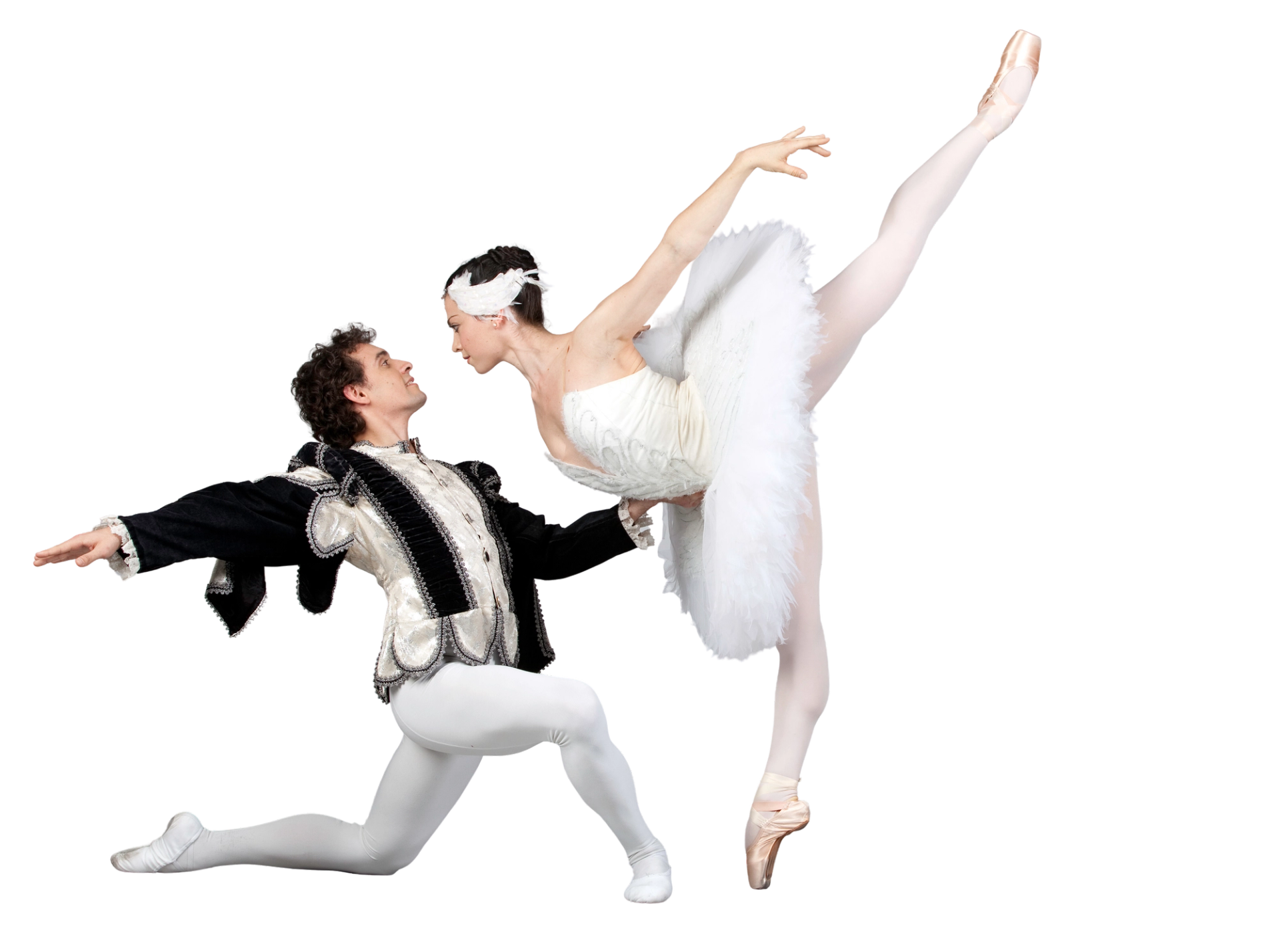 Ballet dancers perform partnered pose, one kneeling in black, one en pointe in white.