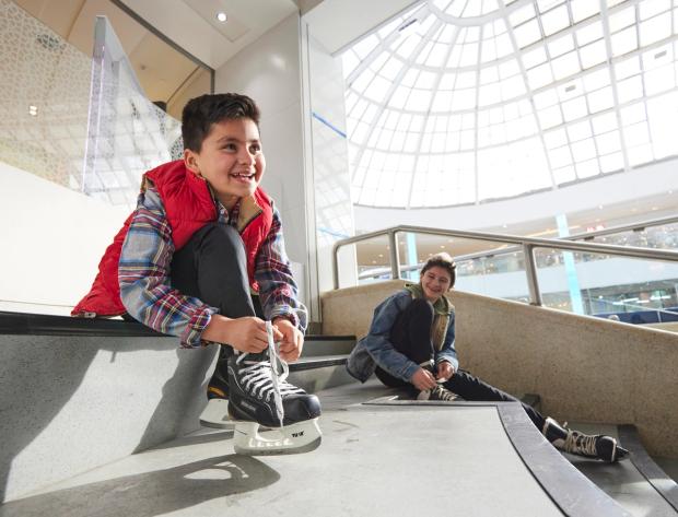 Putting skates on at the Ice Palace in West Edmonton Mall