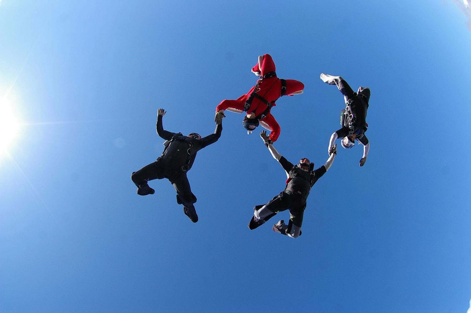 Four people skydiving