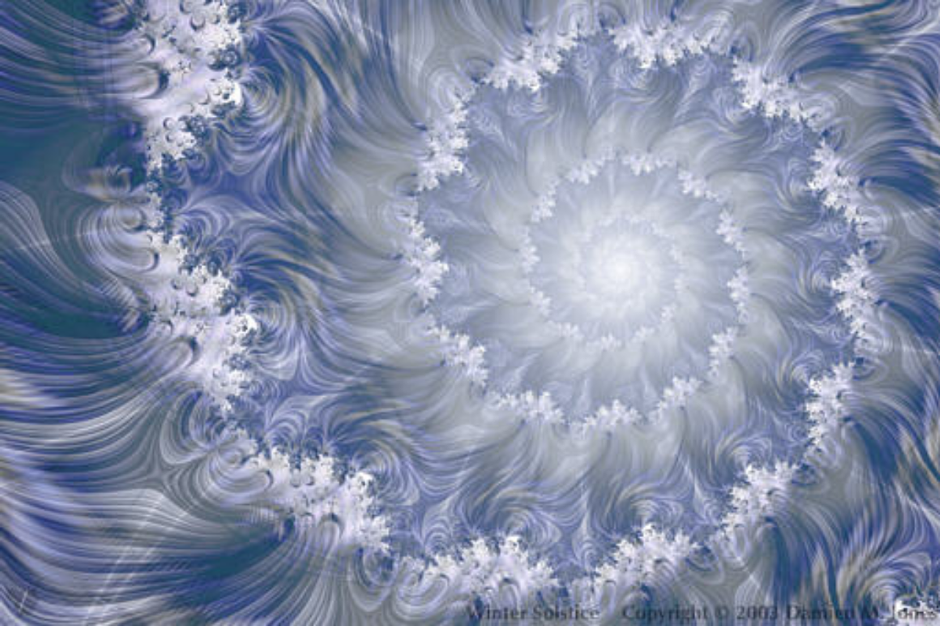Swirling icy patterns forming a spiral in cool blue and white tones.