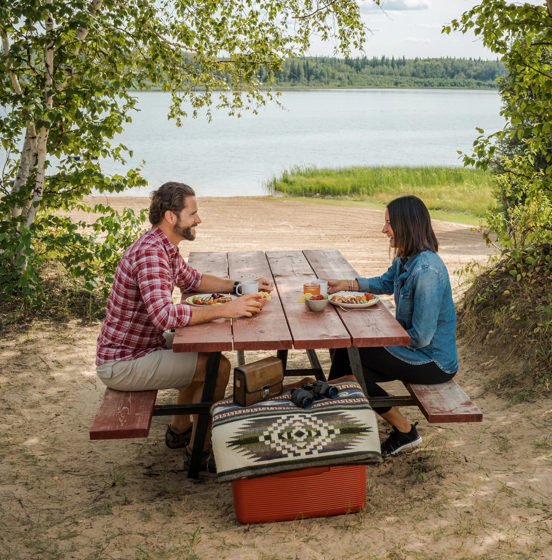 Couple having a picnic by the lake at Hope Lake Campground.