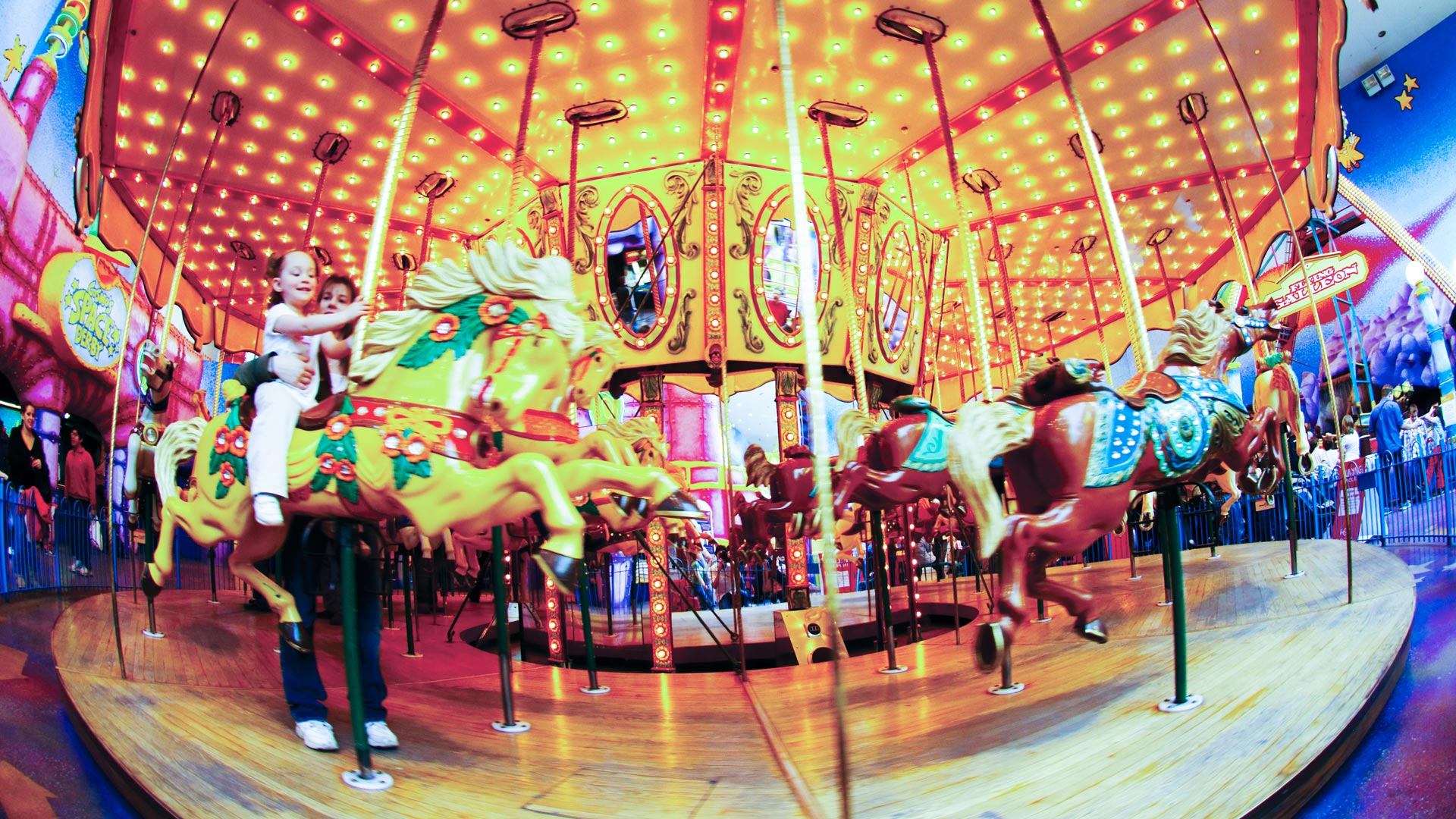 Children riding the carousel