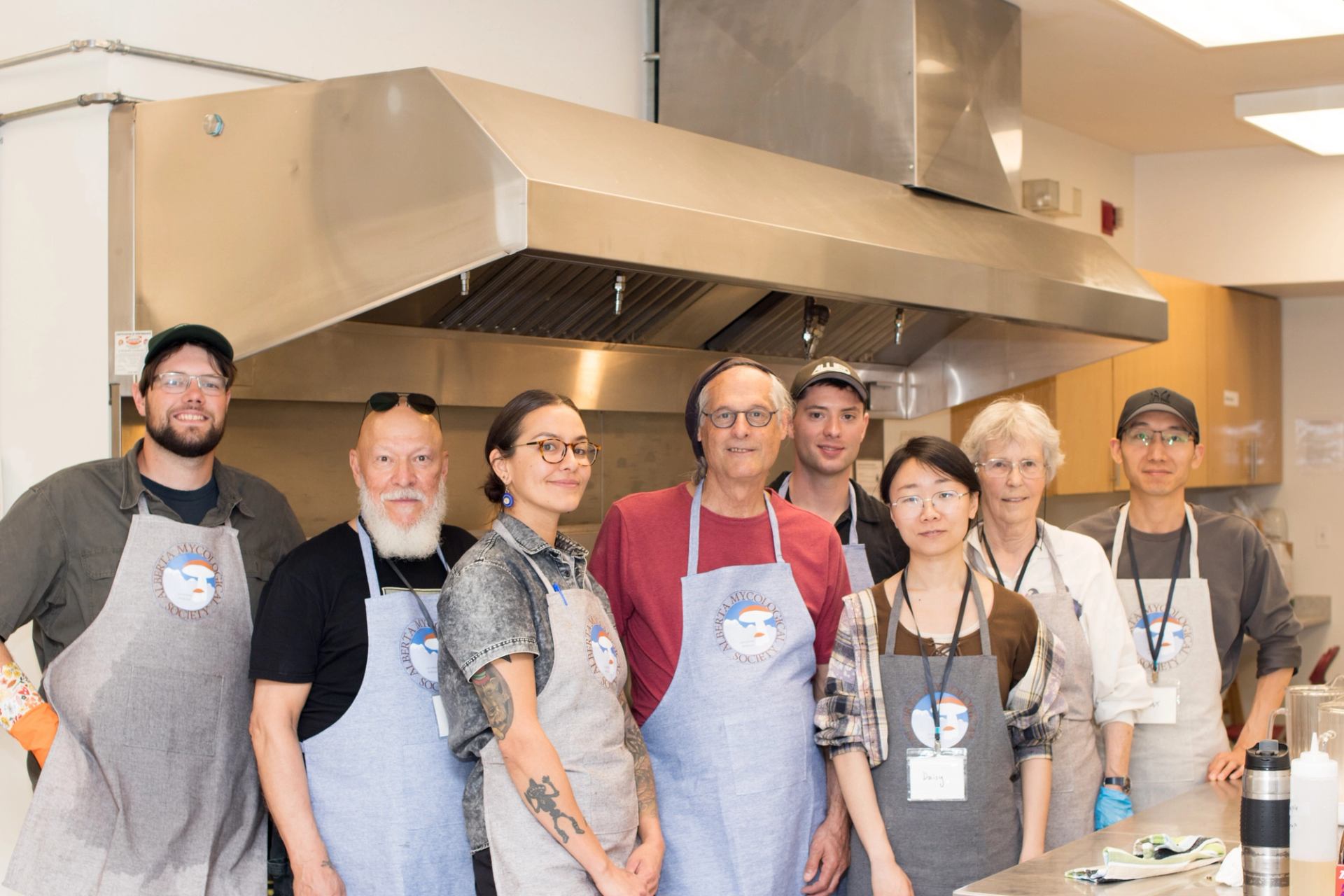 Volunteer chefs at Expo lined up in a kitchen.