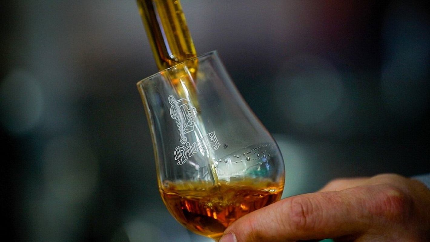 Pouring a glass of whiskey