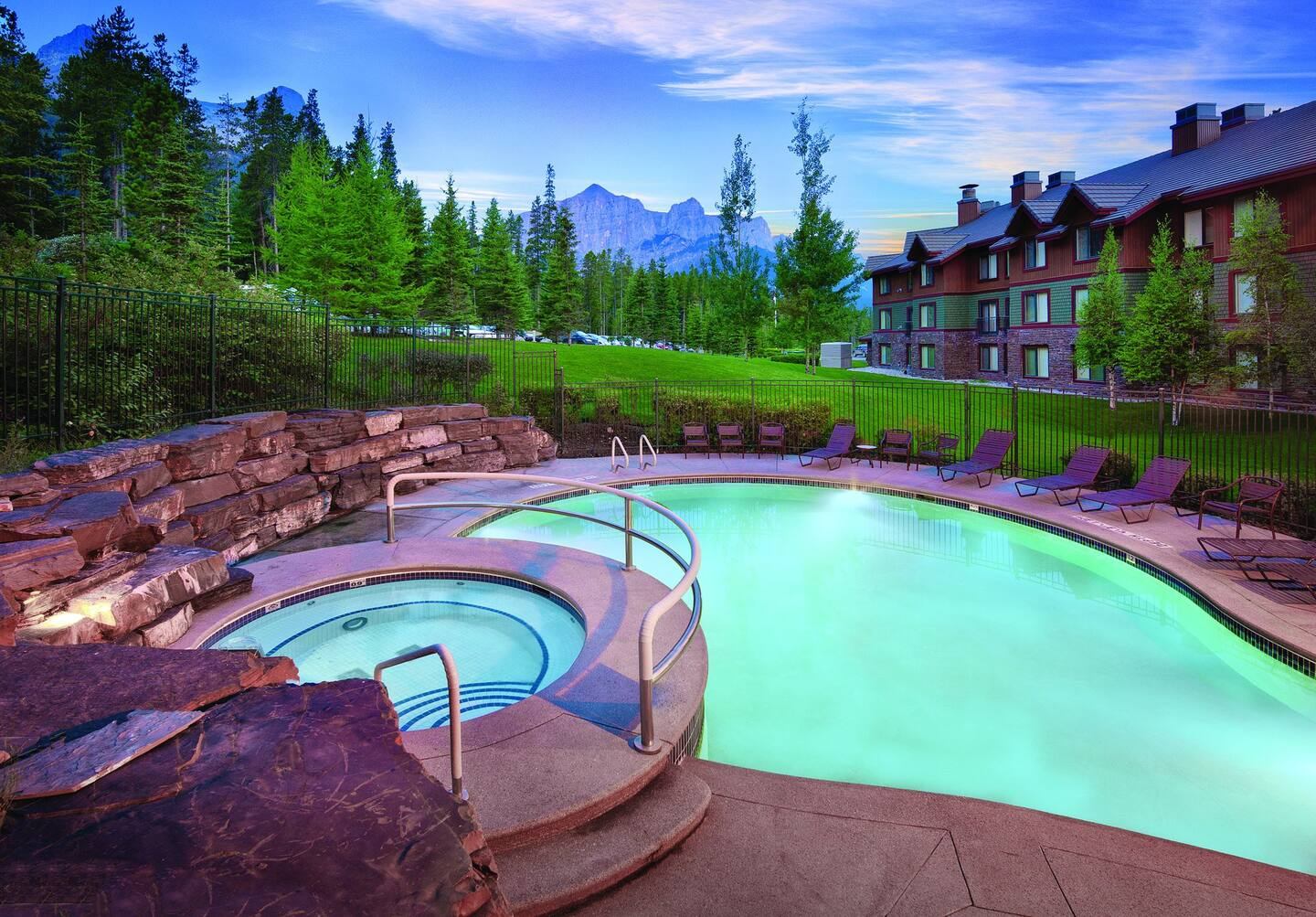 Beautiful outdoor hot tub and pool with mountain views.