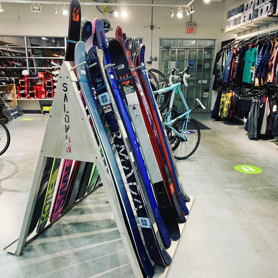 A rack full of skis on display in the store