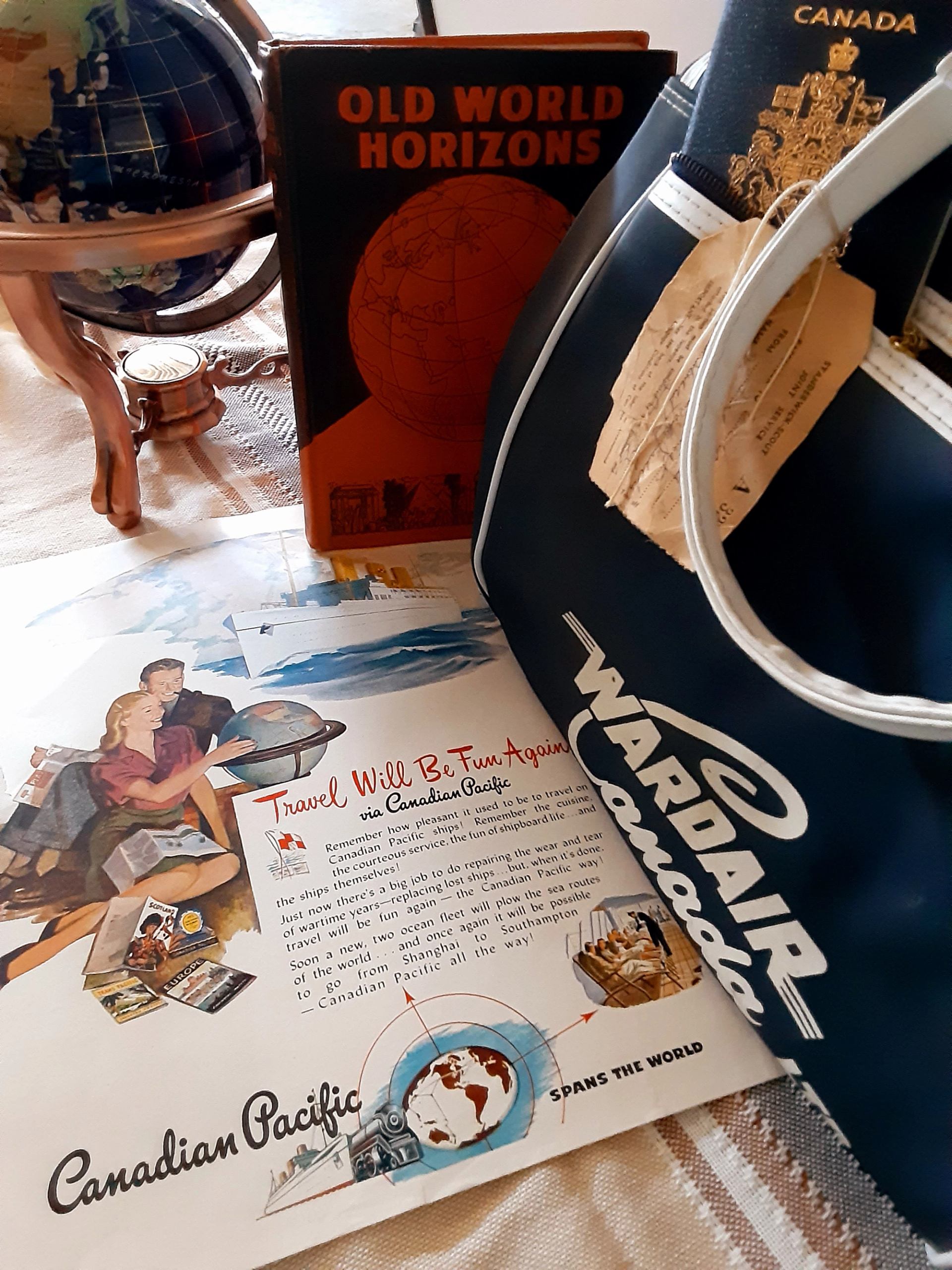 Globe, vintage book and travel bag displaying products for heinventures.ca