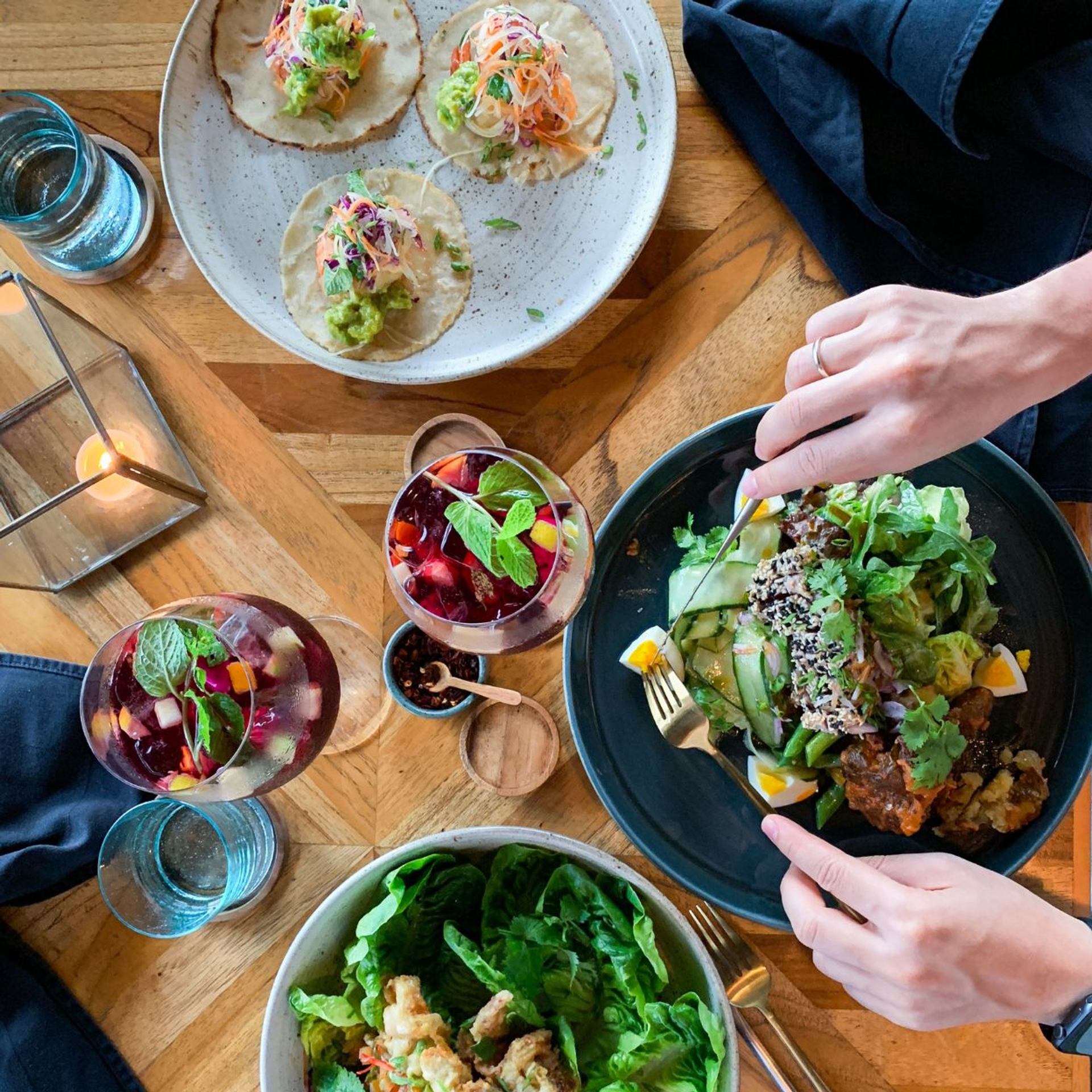 Tacos, salads, and sangria on a table during Canmore Food Walk Tours.