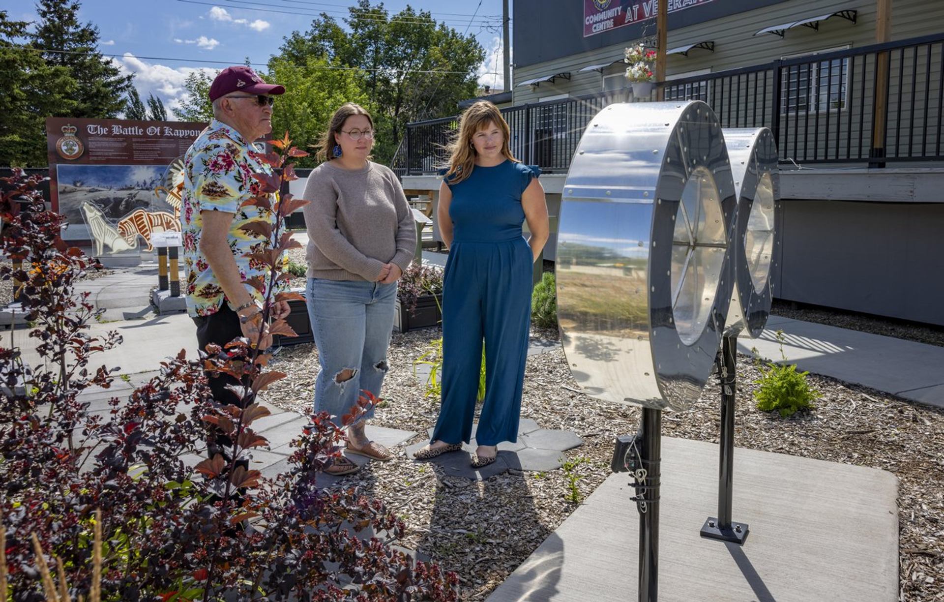 Infinity by Grant Berg of Grant Berg Art Gallery being viewed by an elder and two female guests