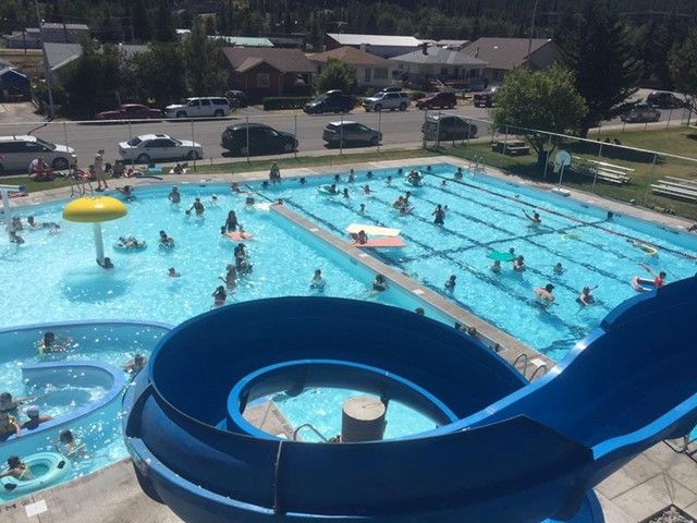 An aerial view of the pool with the waterslide in the foreground.