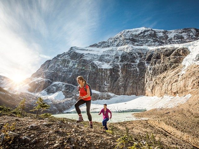 People hiking up a mountain in Jasper National Park.