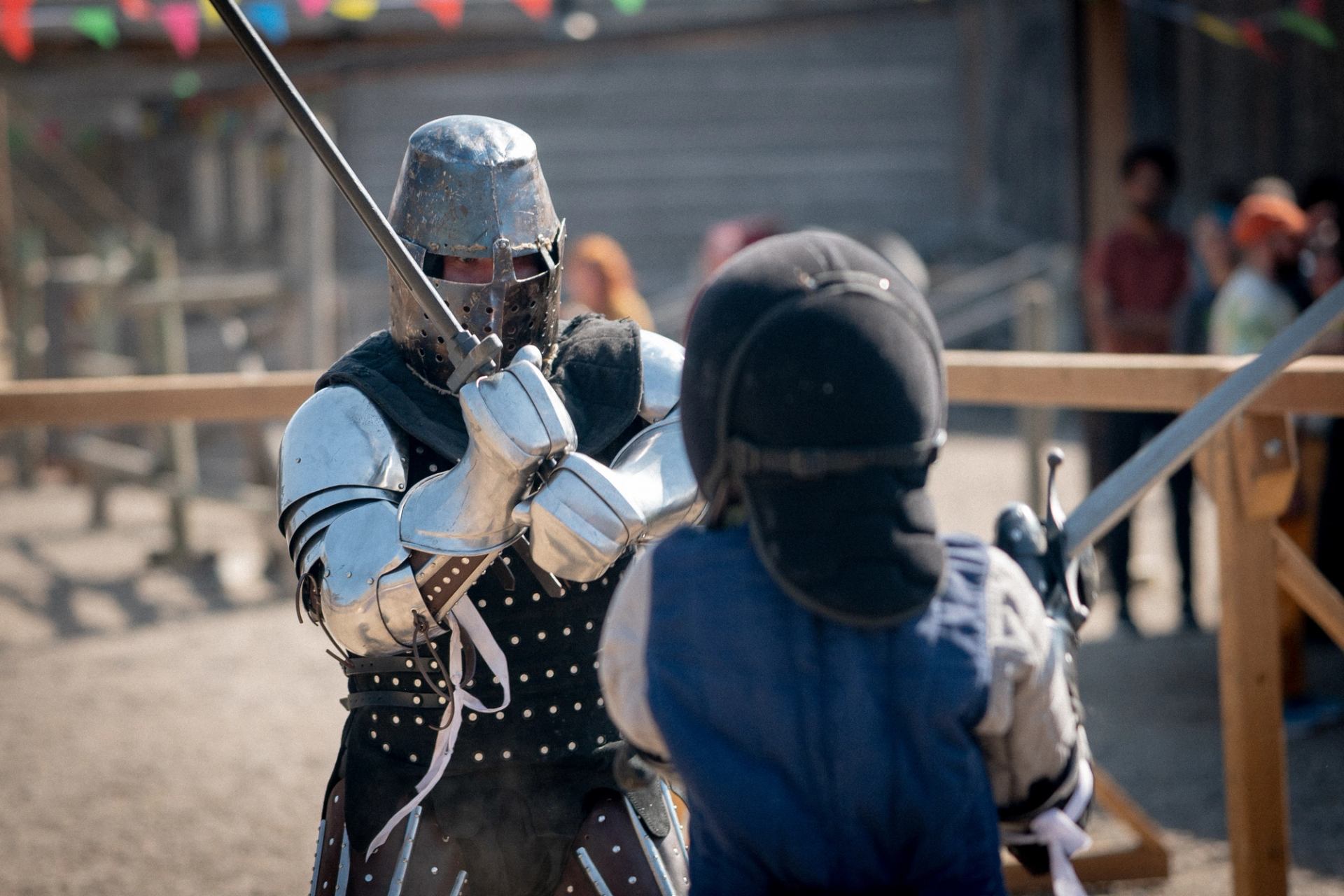 Two knights cosplay battle at the 2025 Renaissance Fair, held at Fort Whoop Up.