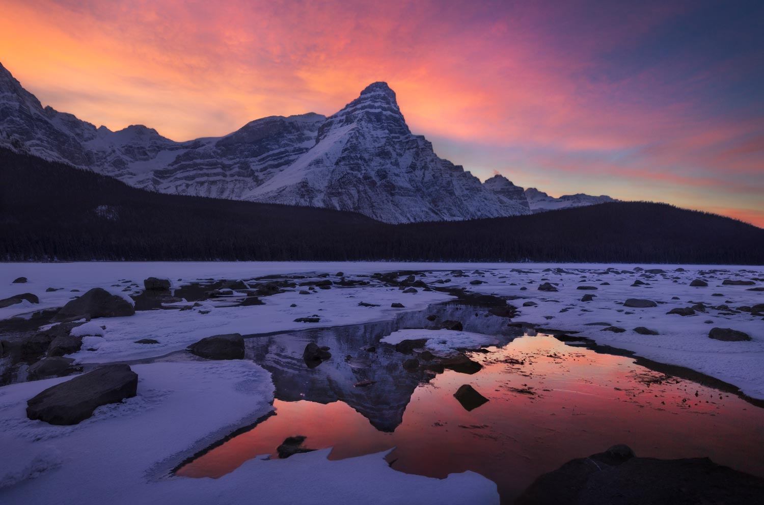 The sun rising behind the mountains