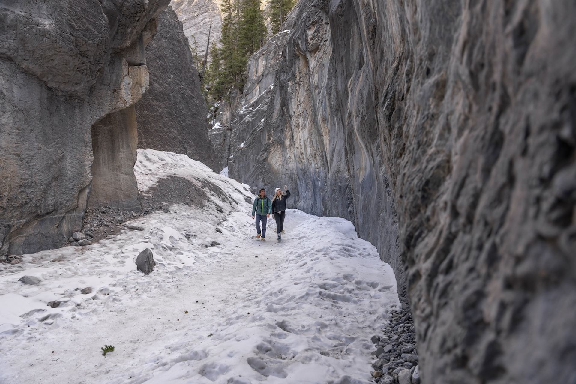 Two people walking the Grotto Canyon Trail.