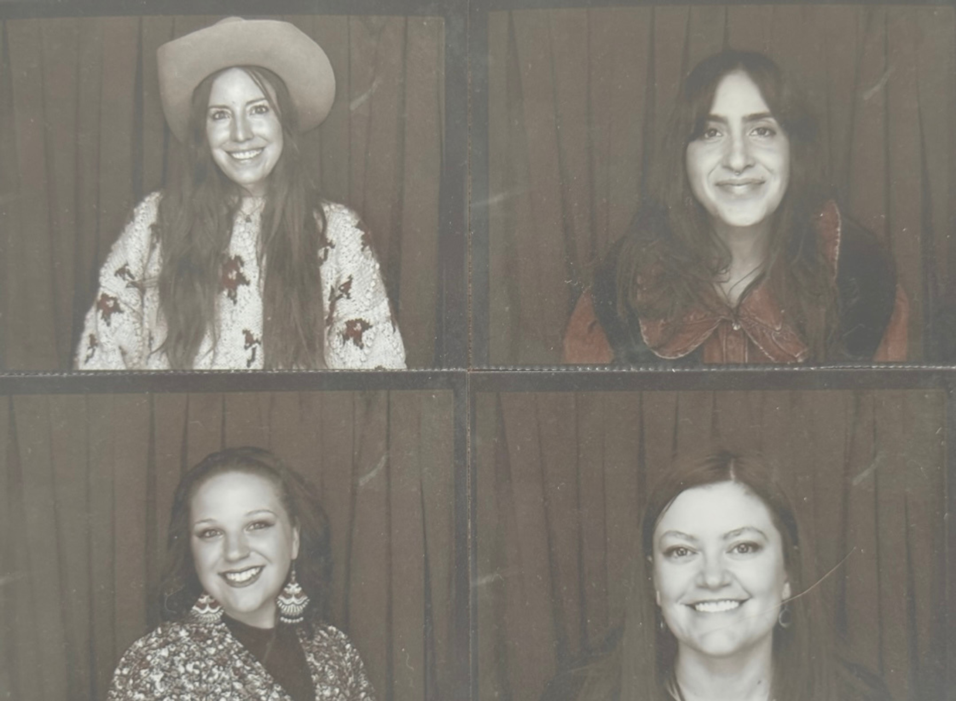 Four portrait photos of people smiling in front of a curtain backdrop.