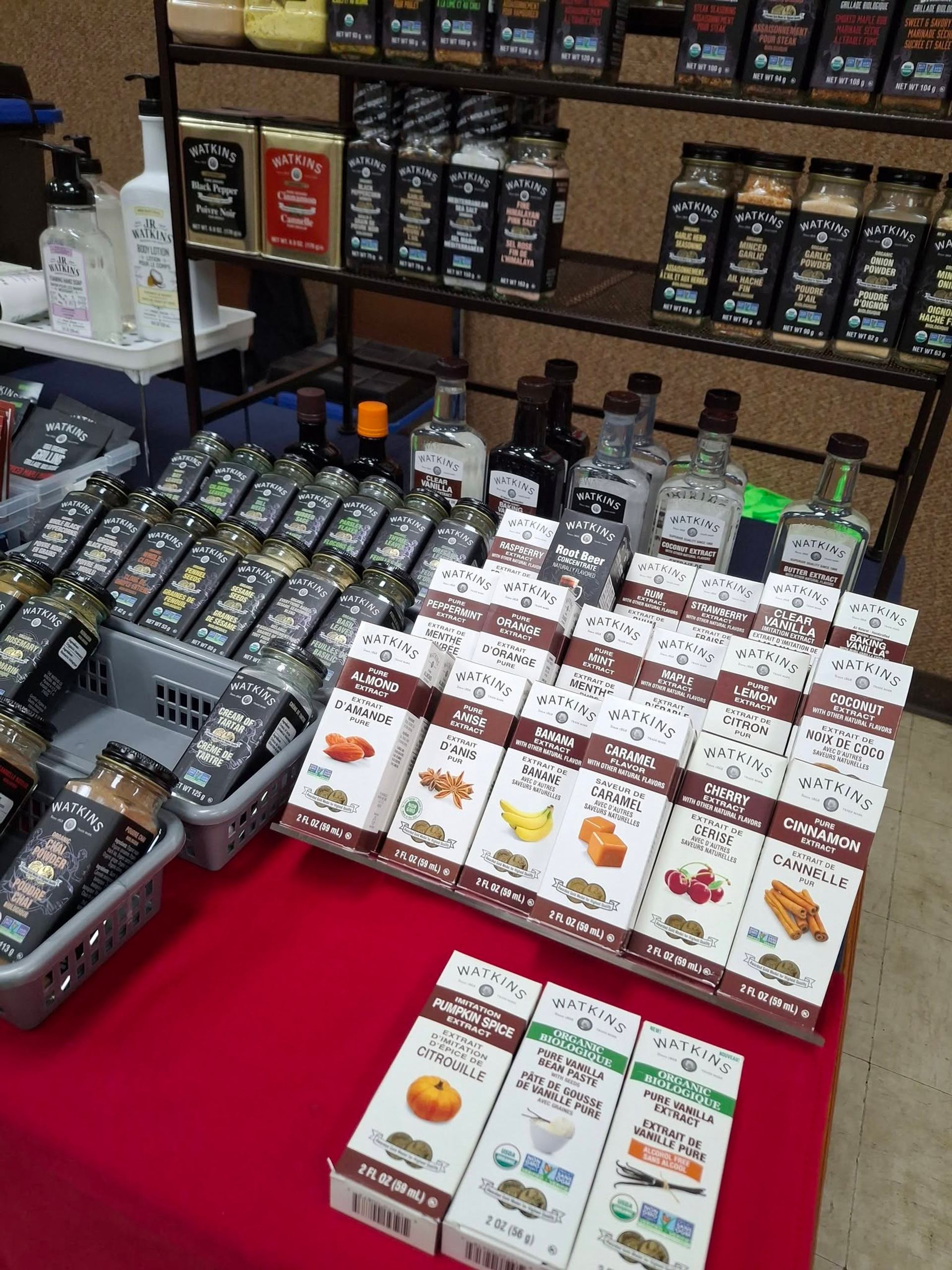 Vegreville Farmers' Market features spices, extracts, and seasonings neatly displayed by a vendor.