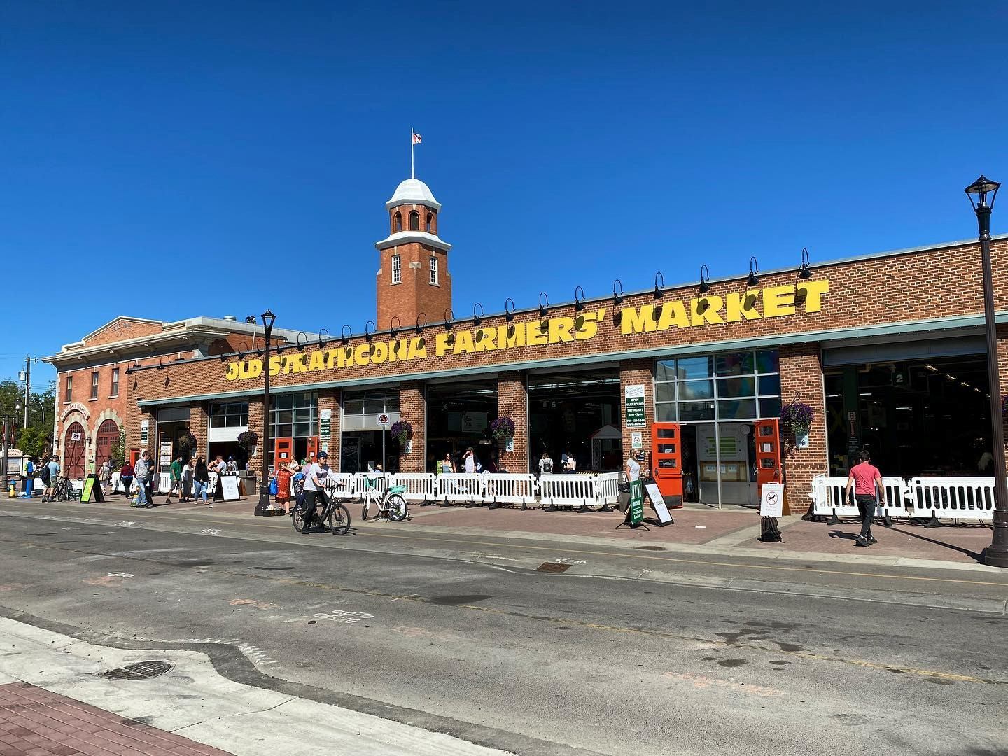 Exterior of Old Strathcona Farmers Market under clear blue sky