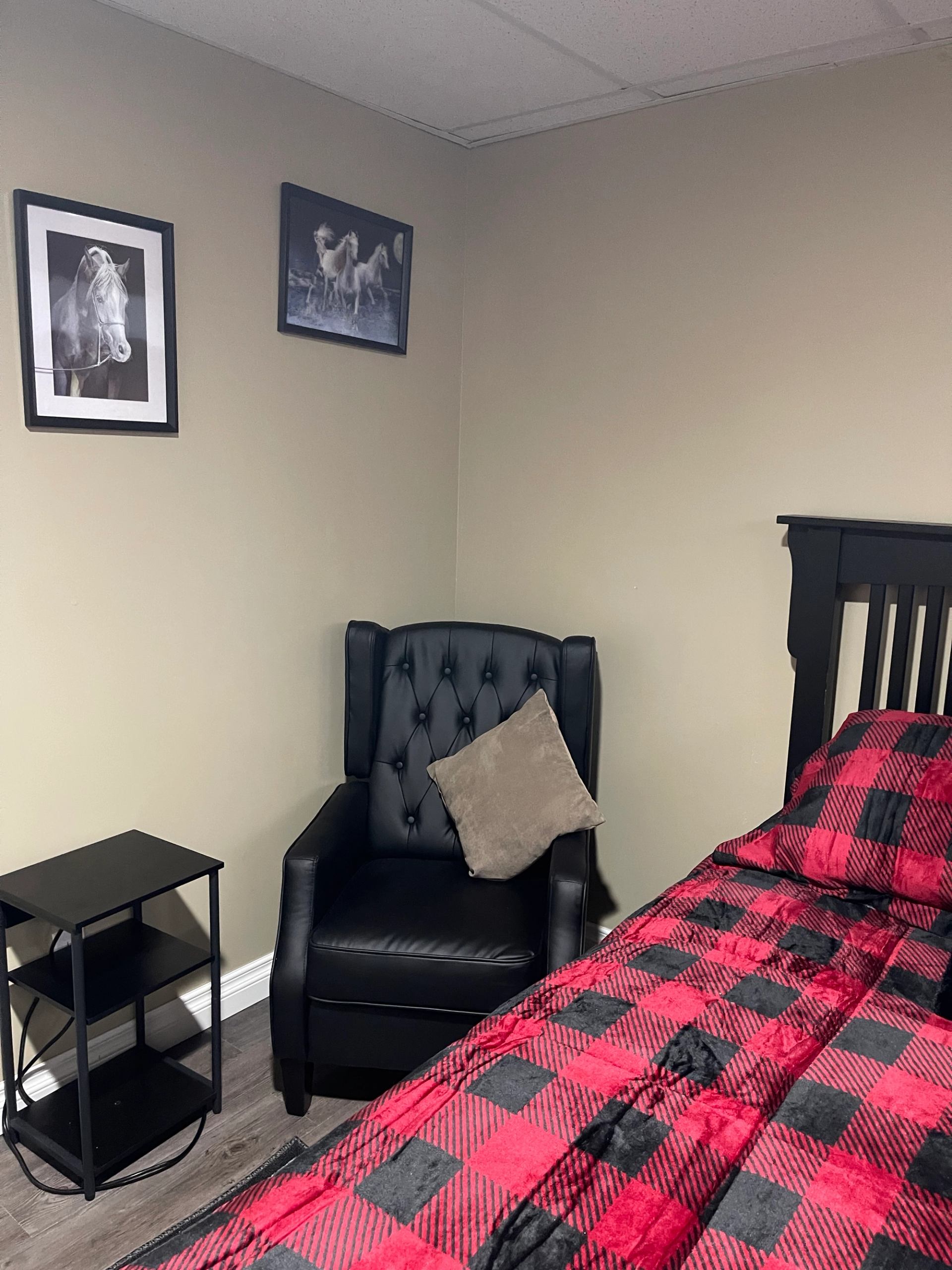 One of the guest rooms with a comfy chair.