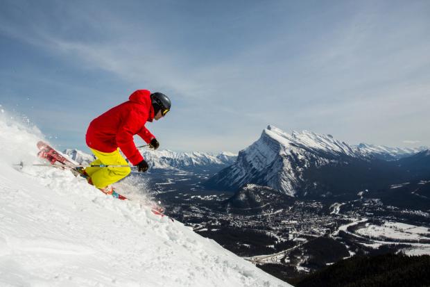 Man skiing a steep drop at Mt. Norquay in Banff National Park