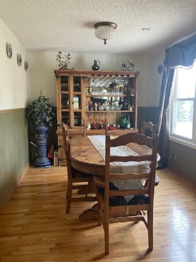 Dining room with a hutch and table and chairs.