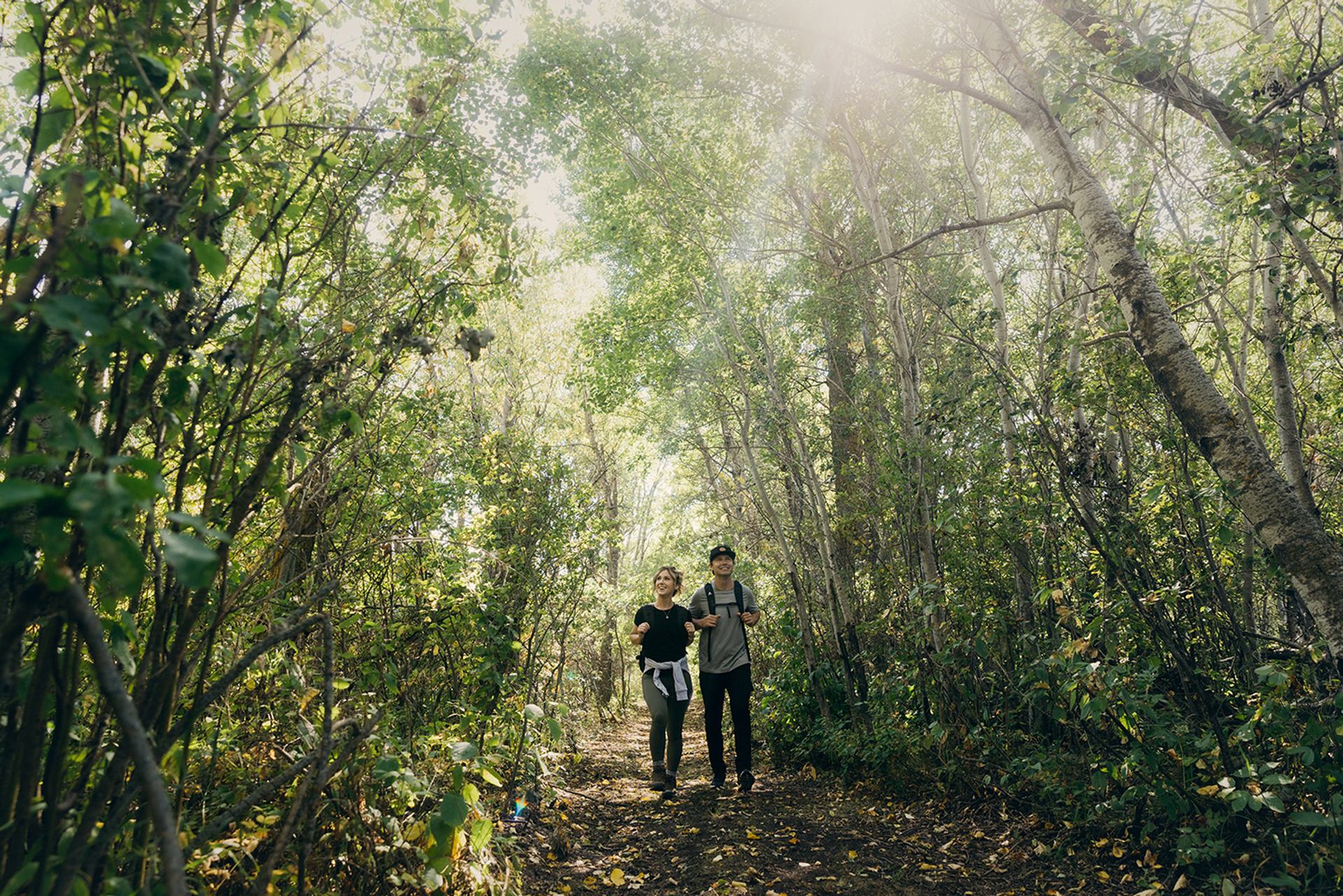 Two people walking through the harvest trail