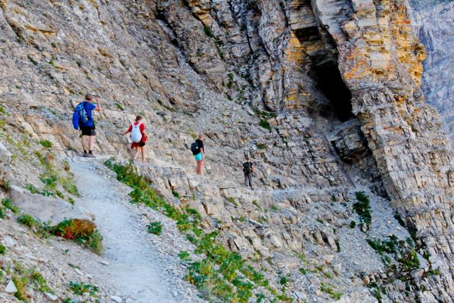 Backpackers hiking the Crypt Lake Trail.