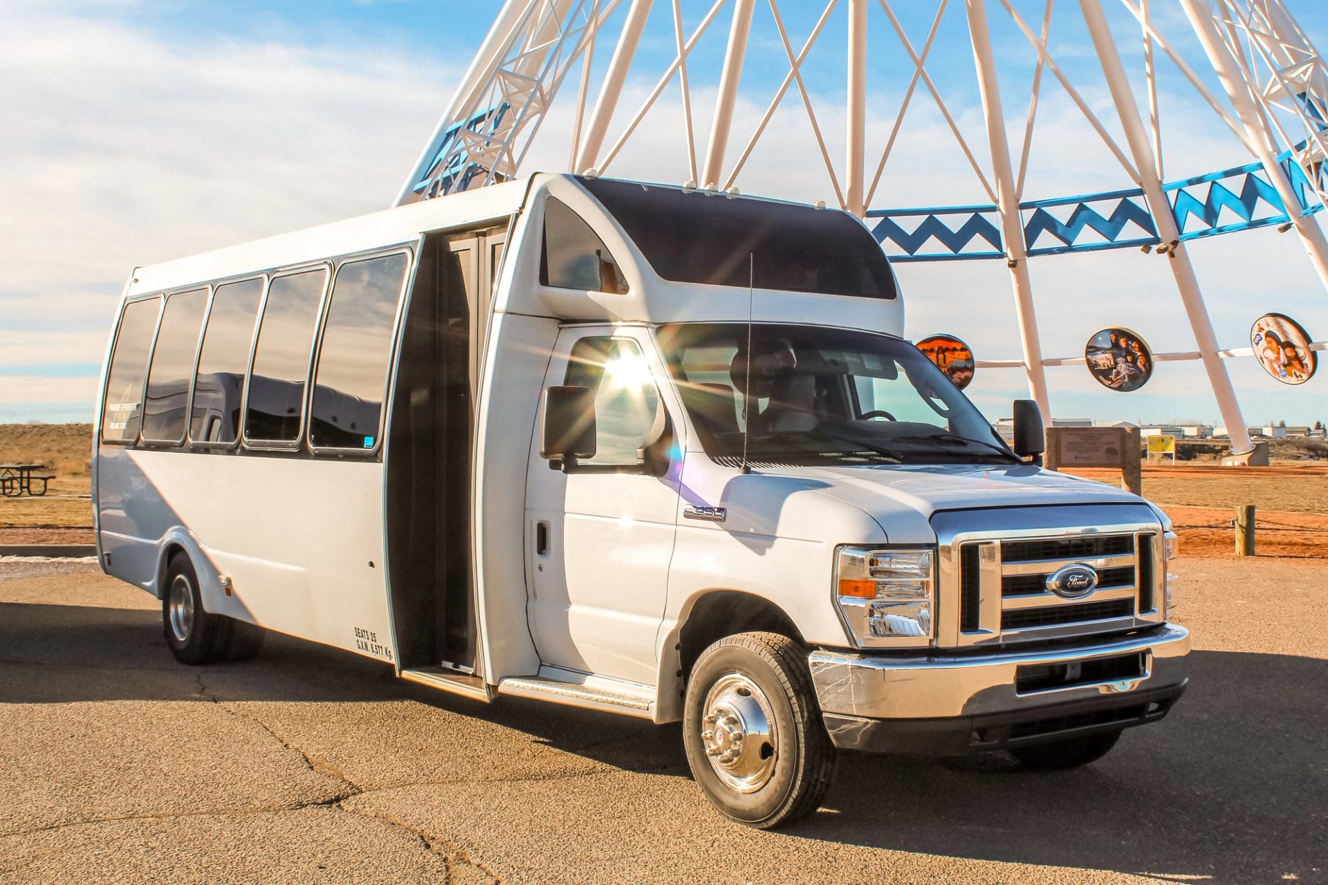 Prairie Sprinter bus in front of the World's Tallest Tipi.