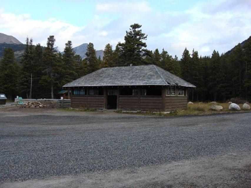Rustic cabin in forested mountain setting at Mosquito Creek.