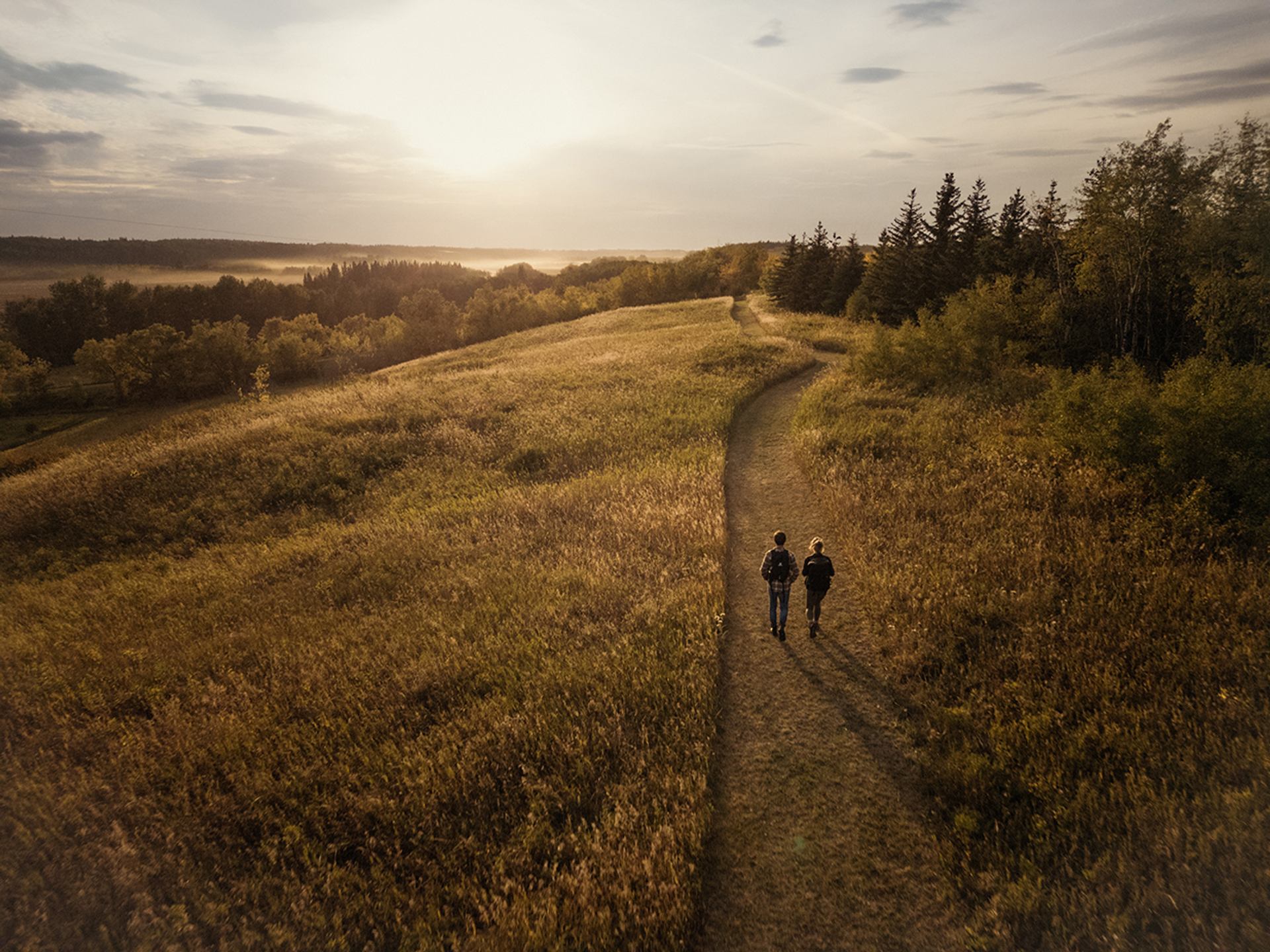 Two people hiking on a trail