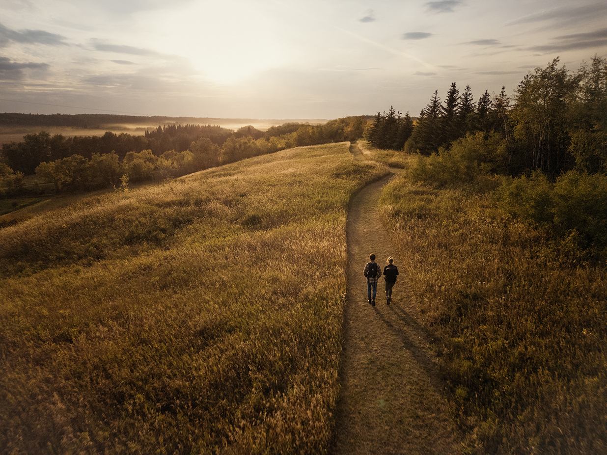 Two people hiking on a trail