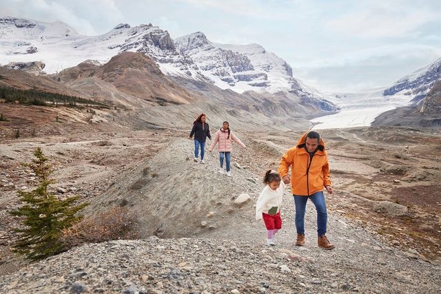 Family exploring the Columbia Ice Fields in Jasper National Park.