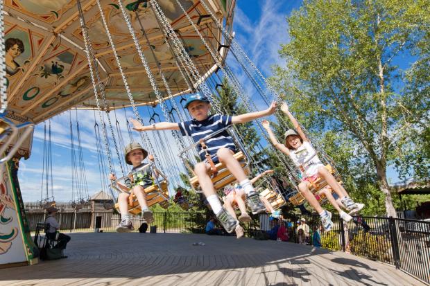 Kids on a swing ride at Heritage Park in Calgary.