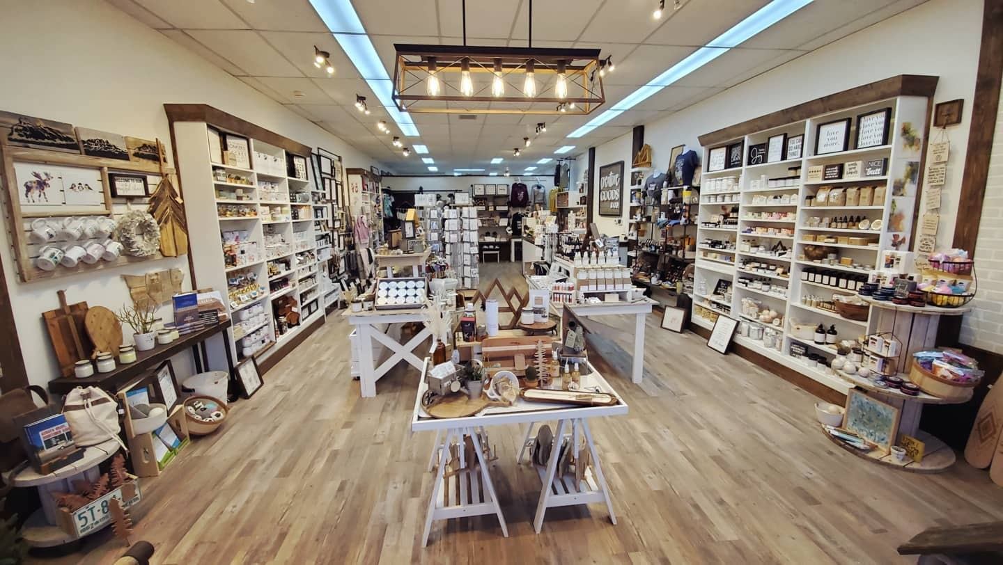 Interior of Creative Goods & Co. with shelves of home goods and warm lighting.