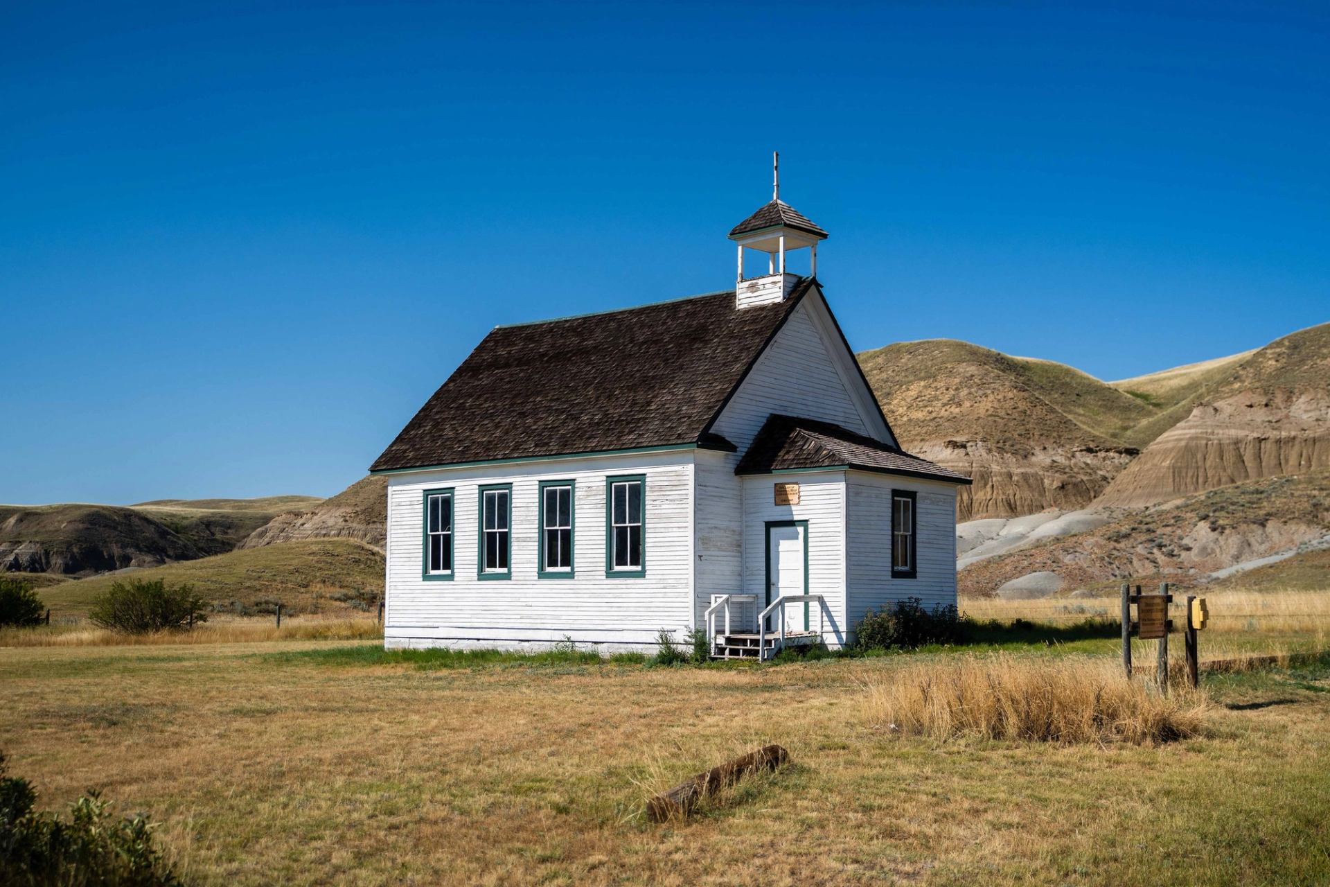 A small wooden church in the Alberta Badlands.