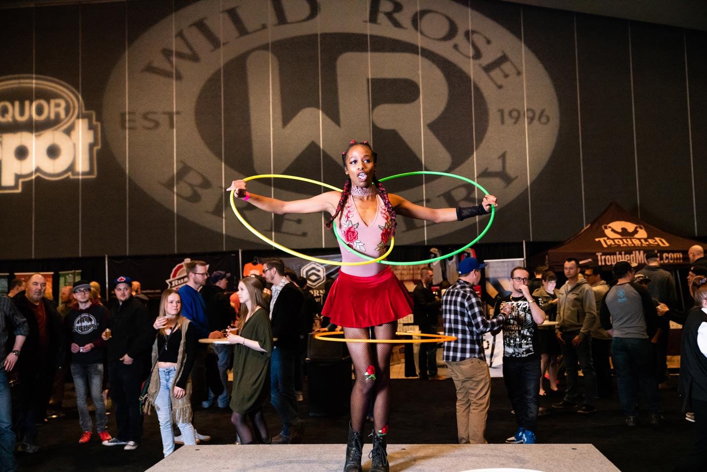 Performer spinning multiple hula hoops at Edmonton’s International Beerfest.