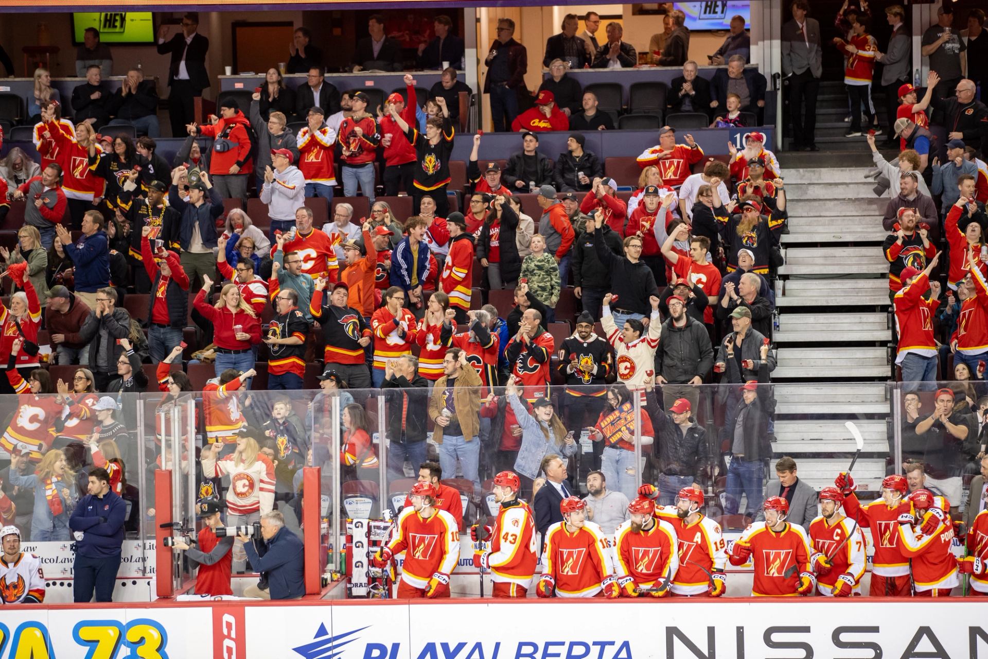 Fans wearing the teams jerseys sat in the bleachers