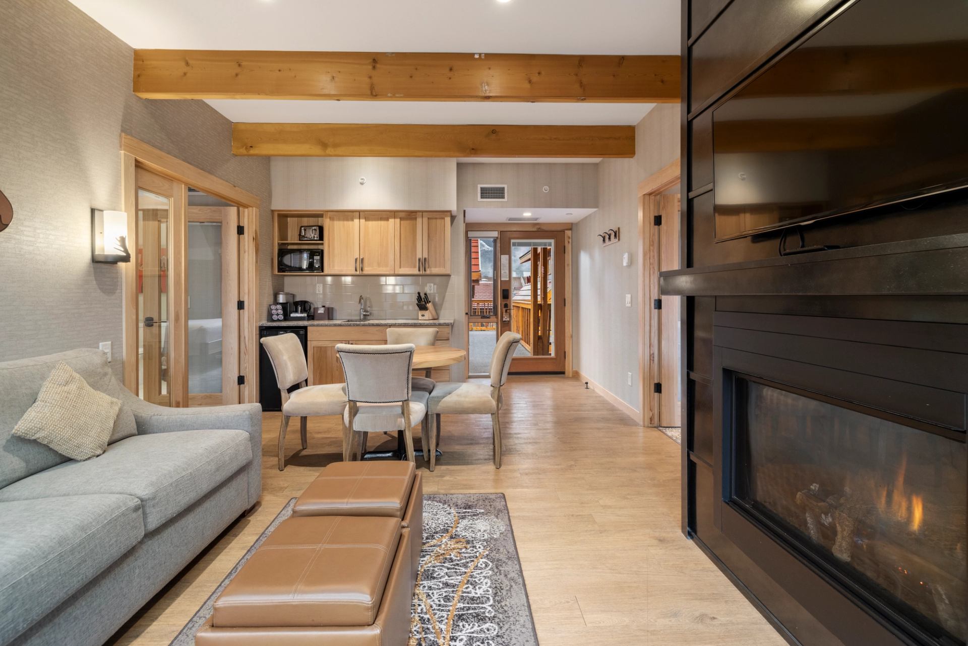 Living area with fireplace, dining room and small kitchenette