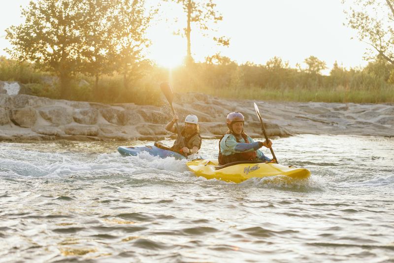 Two people kayaking at Harvie Passage in Calgary