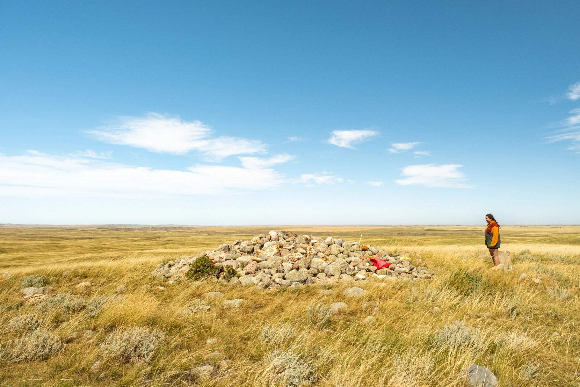 Person visiting the Majorville Cairn and Medicine Wheel.