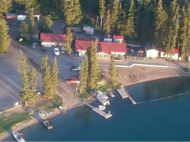 Bodina Resort aerial view of cabins, RVs, boats, and a lakeside dock.