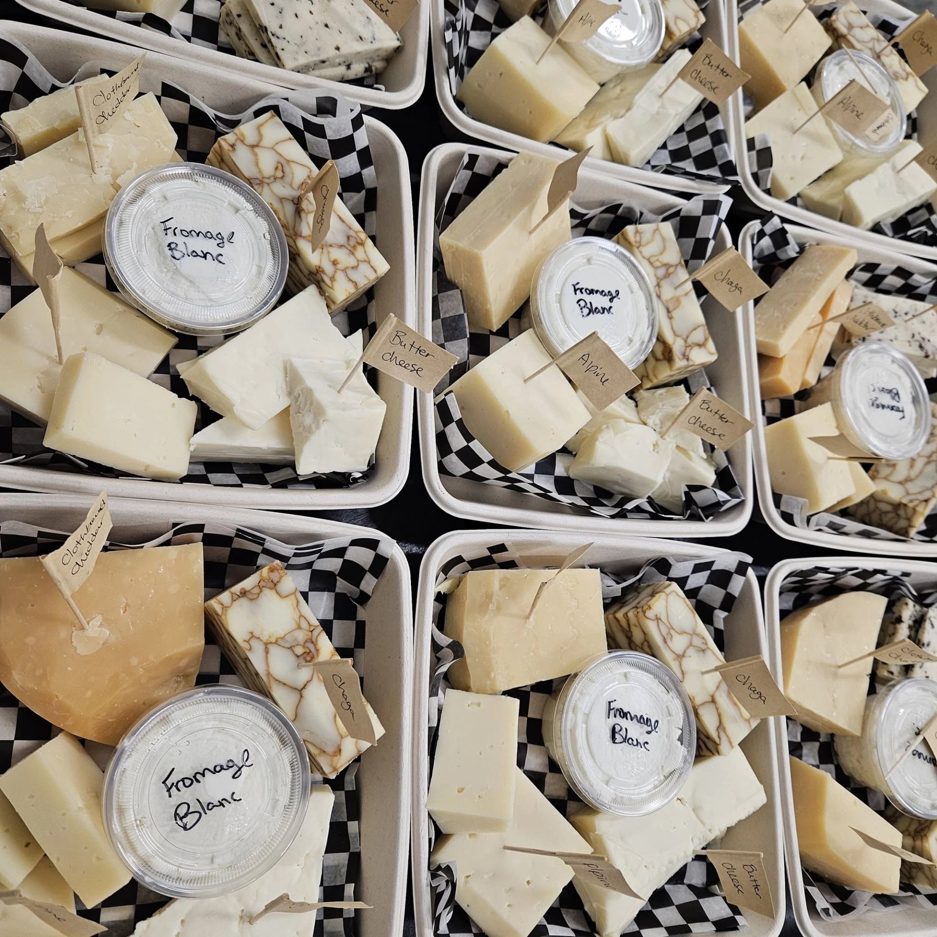 Lakeside Farmstead presents a variety of handcrafted cheeses ready for sampling.
