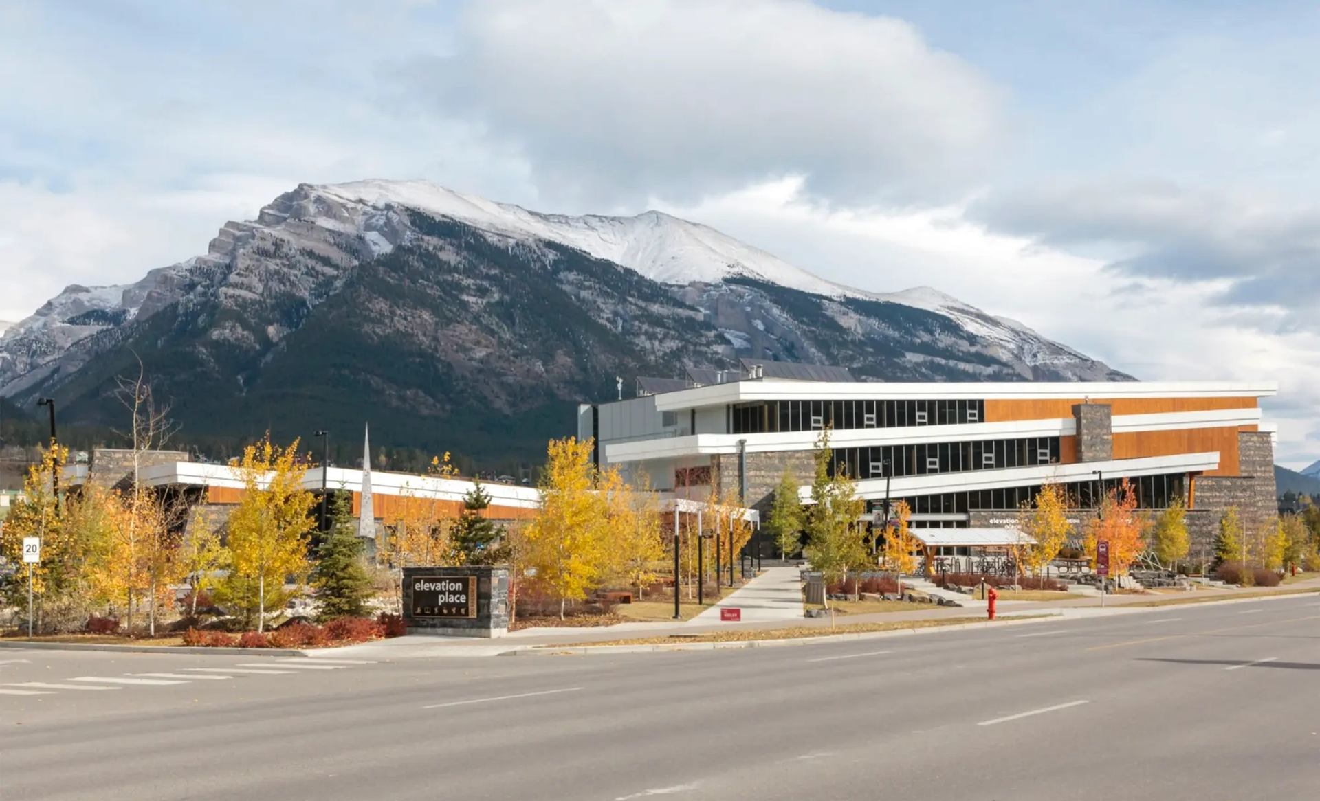 Exterior of the building with mountains in the background.