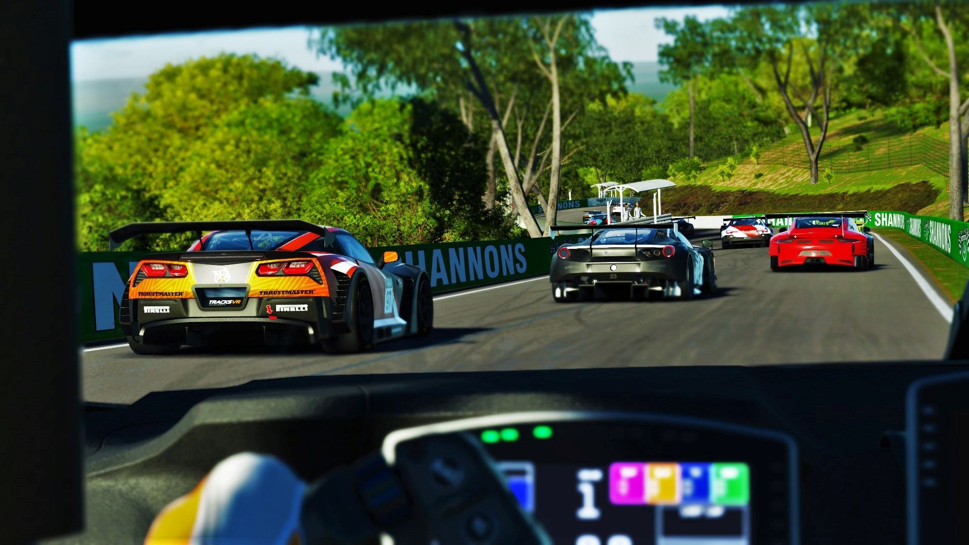 Cockpit view of virtual race car on track with others ahead.