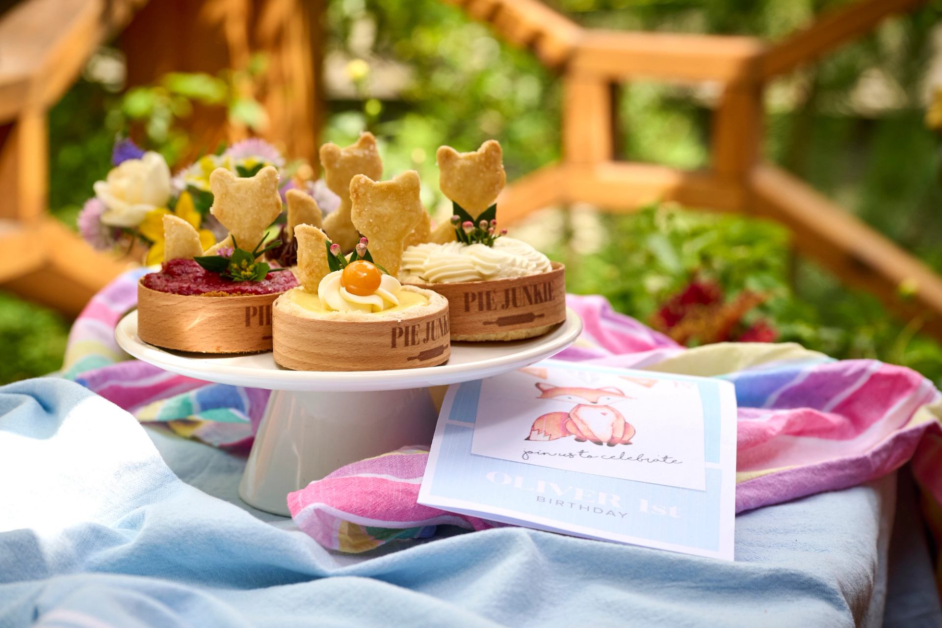 Cute foxes on top of Pie Junkie individual pies for a birthday party.