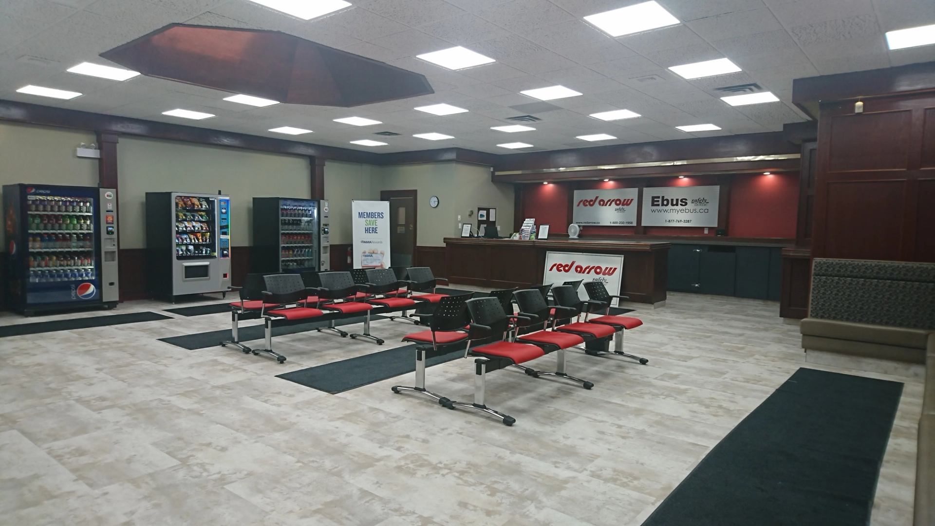 Red Arrow terminal in Red Deer showing chairs, counter, and snack machines.