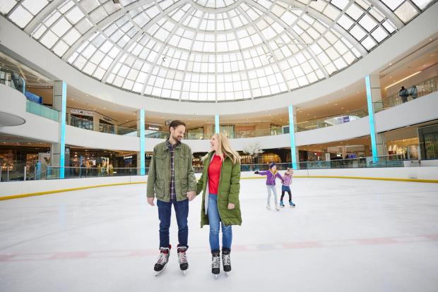 Couple skating at the Ice Palace in West Edmonton Mall