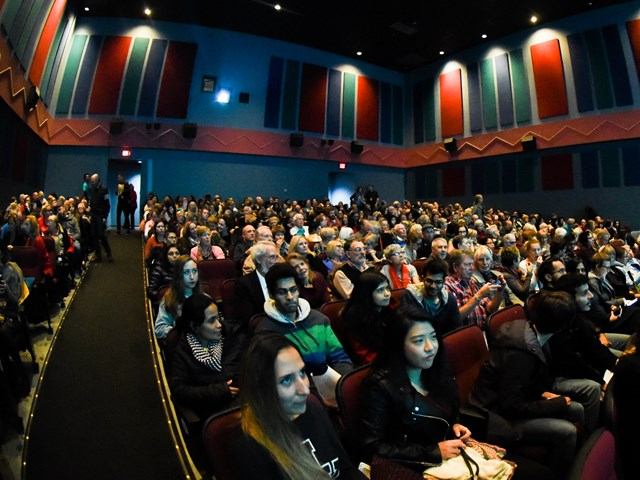 Audience seated in theatre during film screening, Calgary International Film Festival.