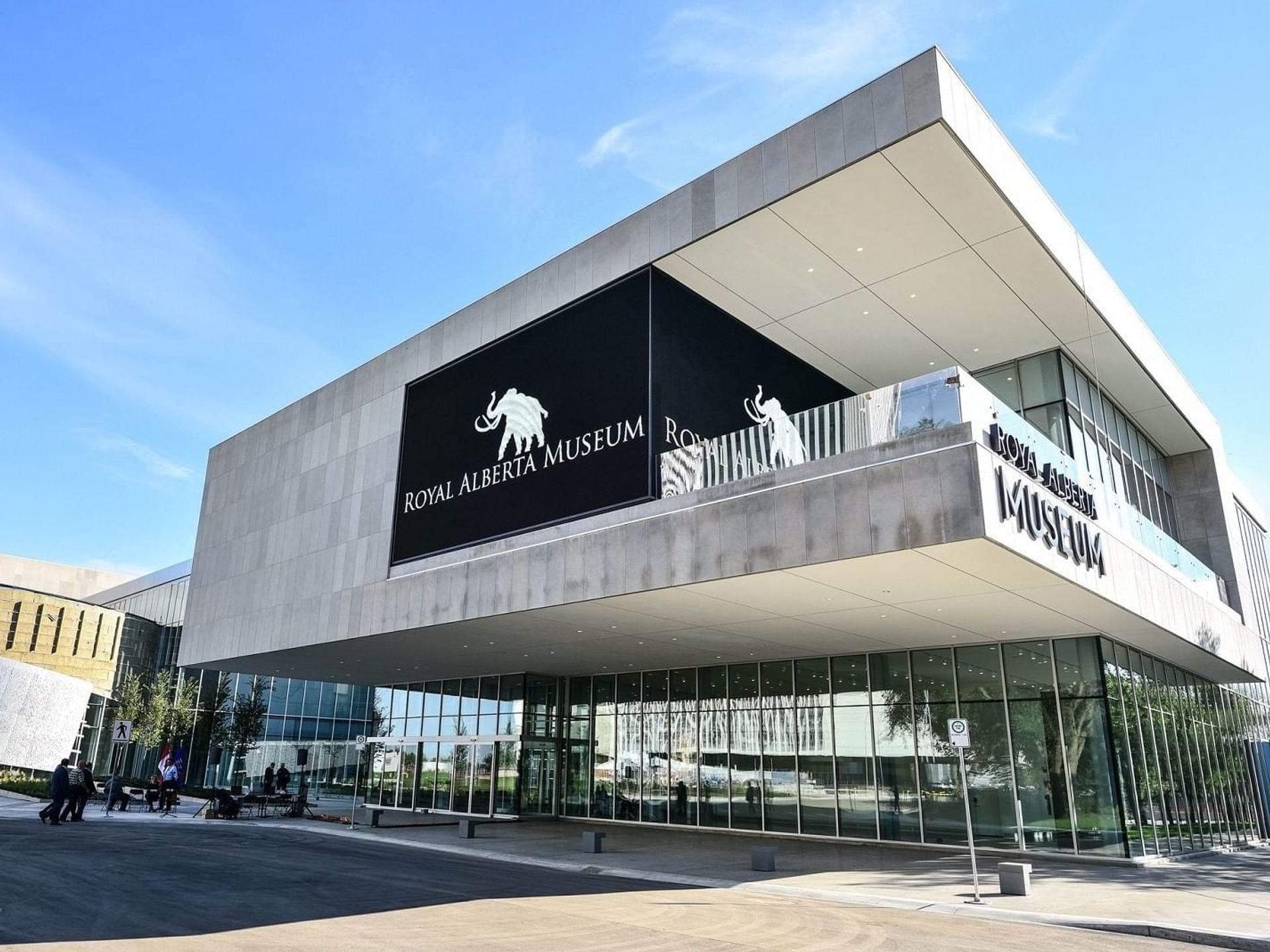 Royal Alberta Museum exterior with mammoth logo and glass entrance under clear sky.