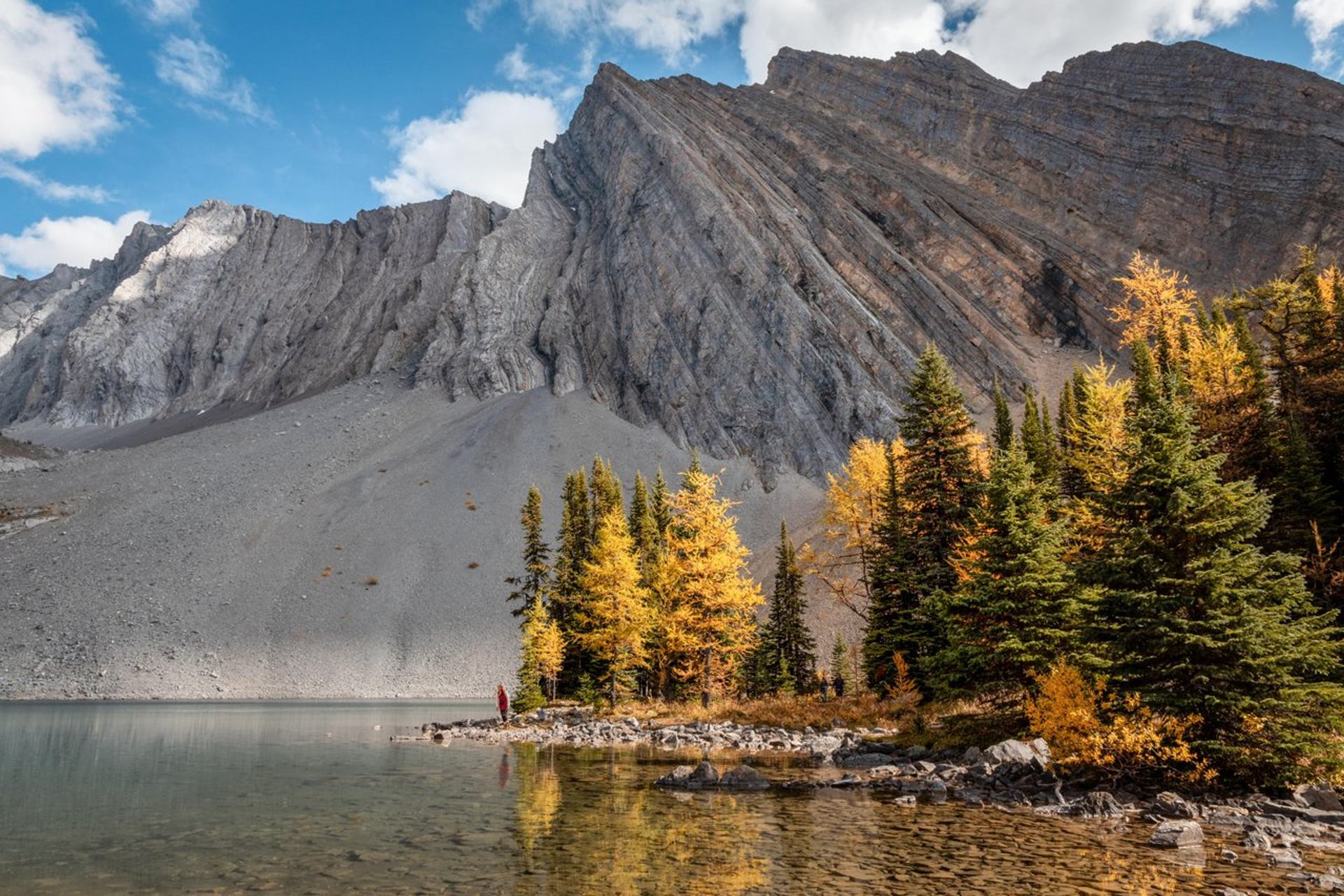 Chester Lake in Kananaskis, with larch trees and a mountain in the background