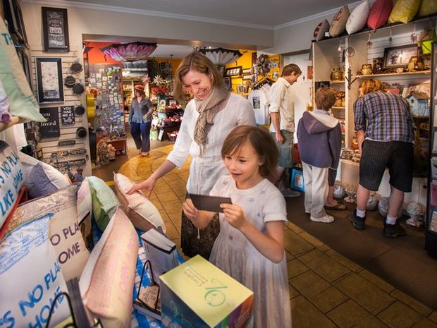 Families shopping in the gift store at the Rosebud Theatre.